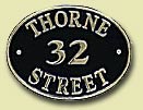 brass house sign