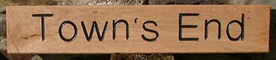 carved wooden signs